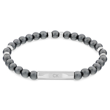 Ανδρικό βραχιόλι Calvin Klein 35000575 με γκρι χάντρες, διακοσμημένο με ασημί στοιχείο από ανοξείδωτο ατσάλι.